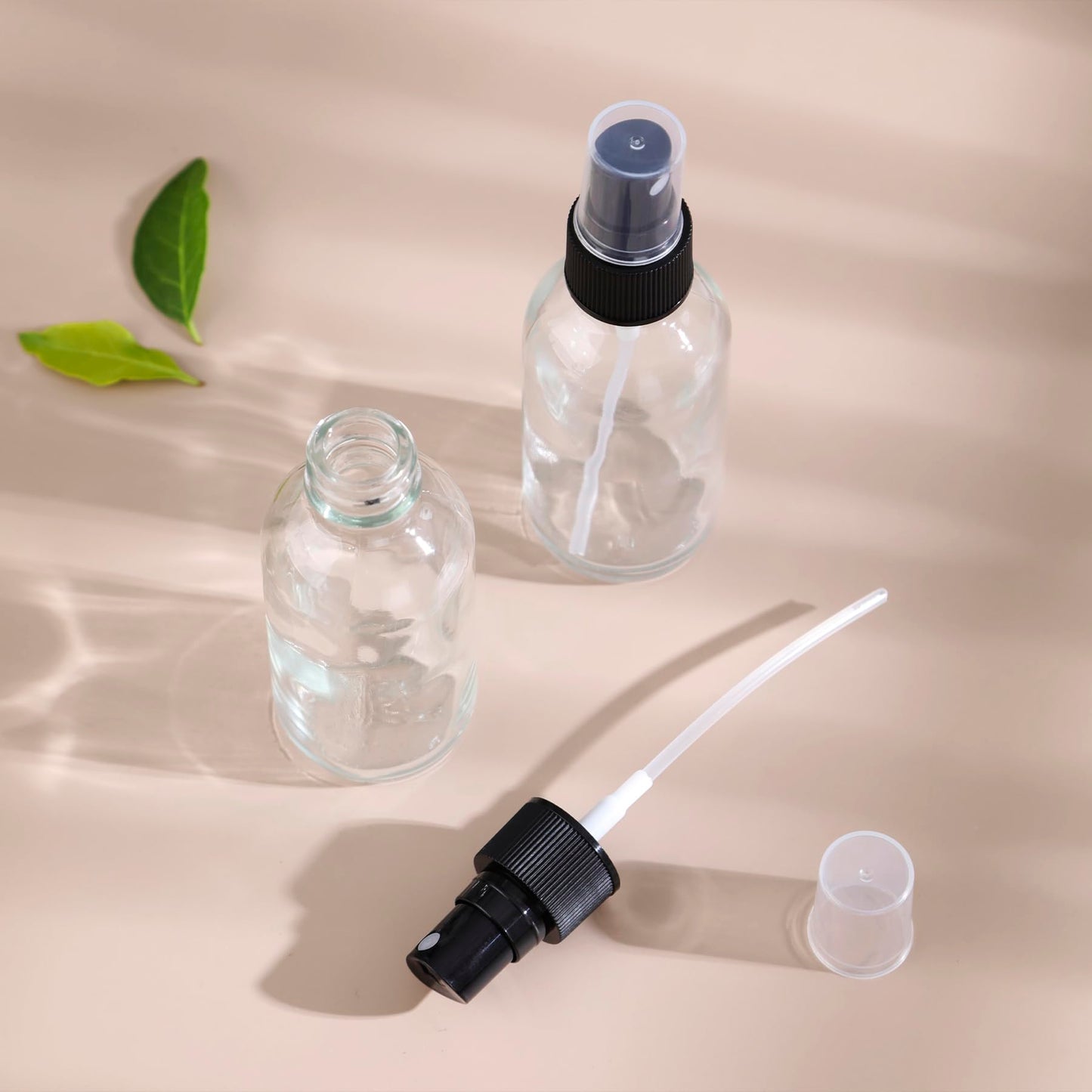 NOOEEISS Clear Glass Small Spray Bottles 2 oz 48 Packs,Fine Mist Sprayer Pretty Finish,Refillable Containers mini spray bottles for Cleaning Solutions and Skin Care (Clear 48Pack)