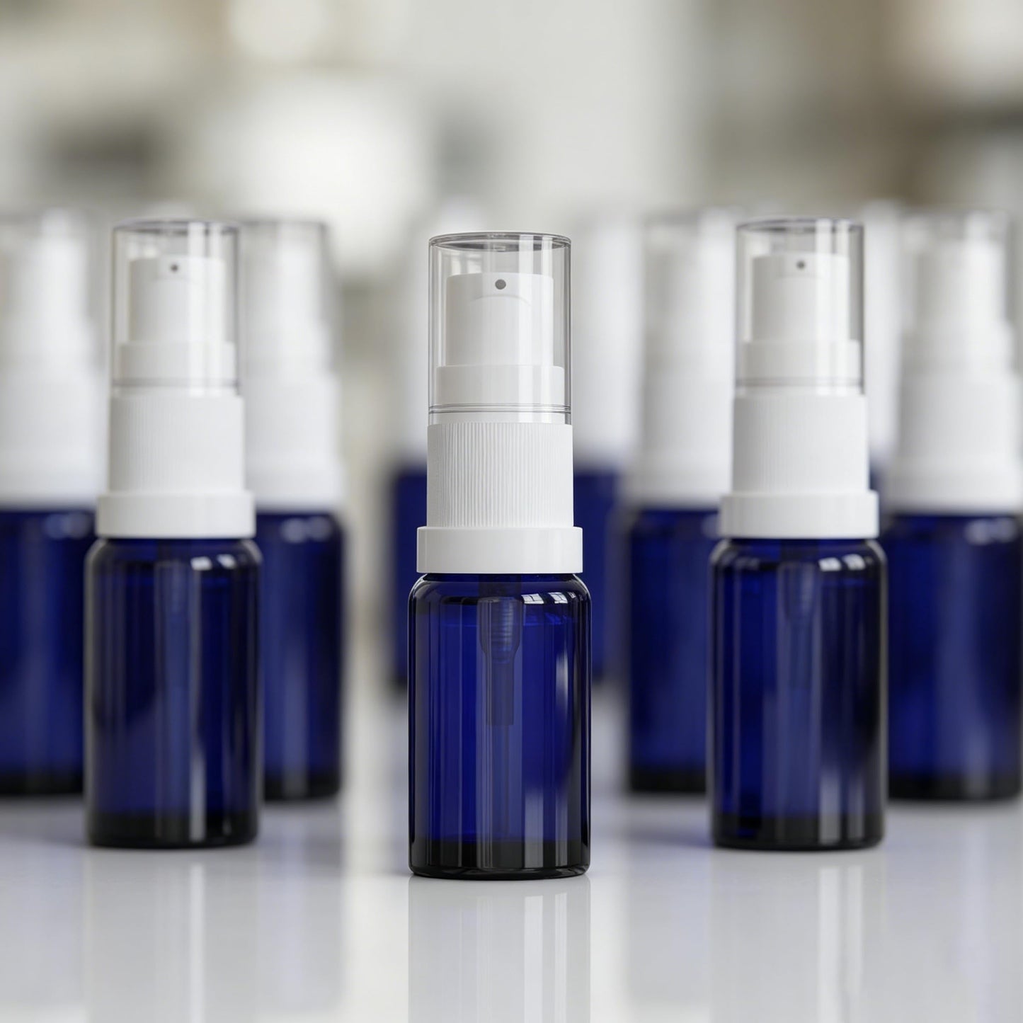 Jagolain 10ml 12 Pack Blue Glass Pump Bottle, 1/3oz Travel Refillable Cream Lotion Essentail Oil Bottles,Empty Small Cosmetic Dispenser Shampoo Containers (10ml blue 12pcs)