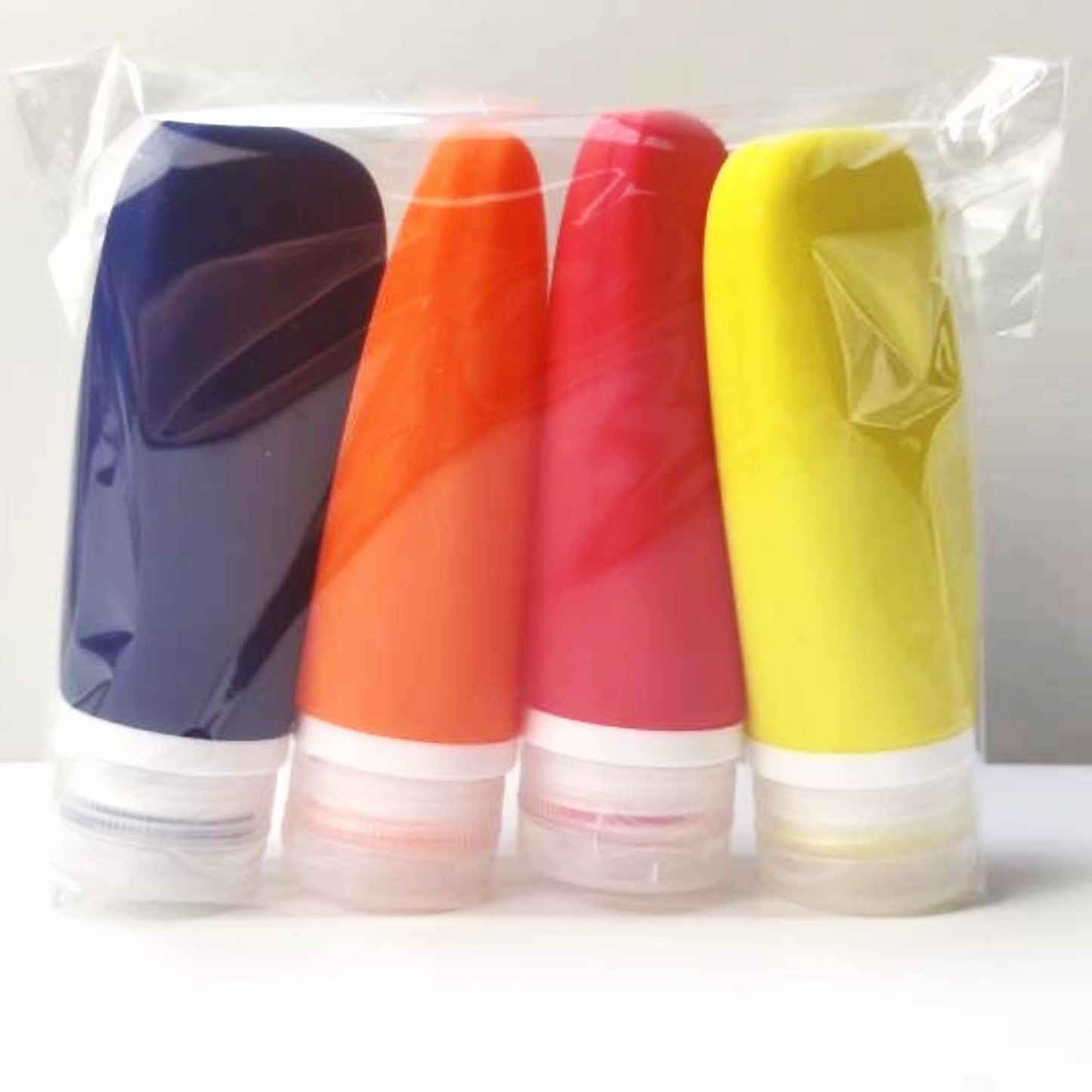 LYOB Travel Bottles for Toiletries, TSA Approved 3 oz Leak Proof Silicone Soft Refillable Squeeze Travel Size Containers BPA Free for Cleansers, Lotions, Shampoo, Conditioner (red,yellow,blue,orange)