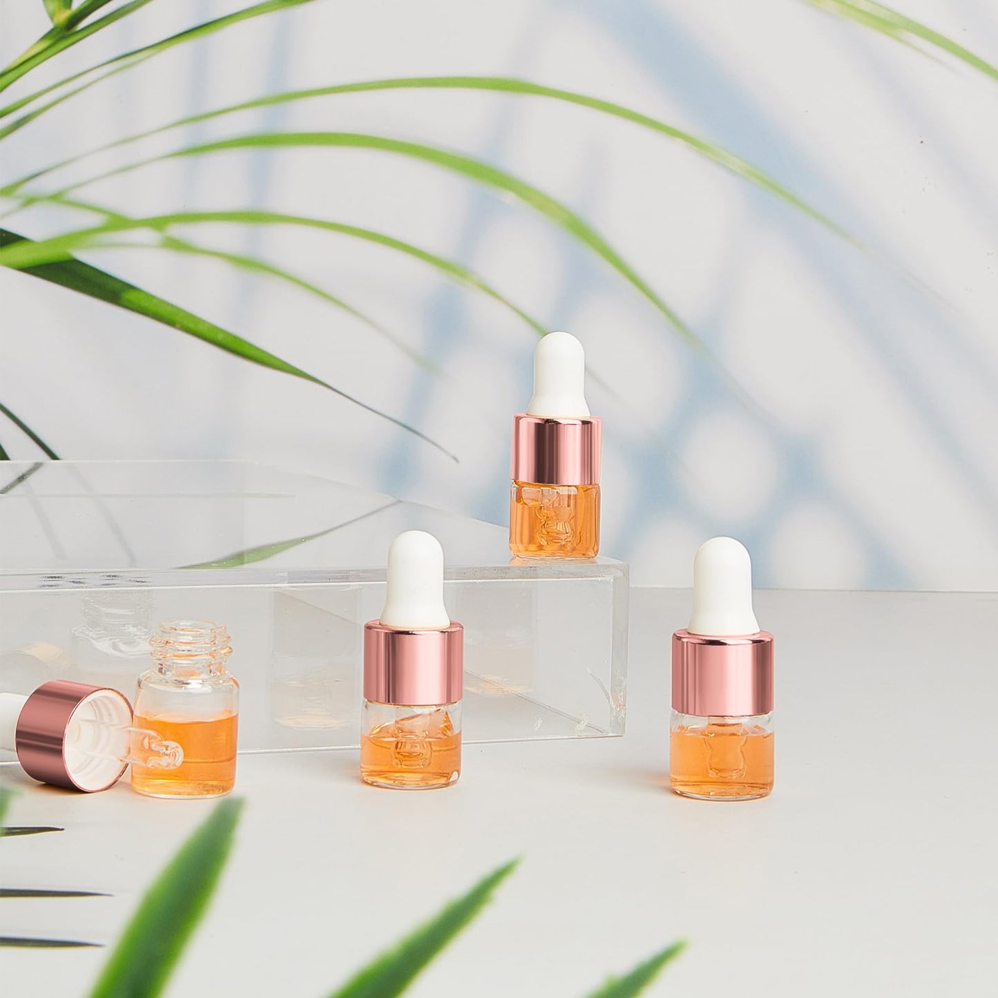 Didaey 100 Pcs 1 ml Mini Glass Oil Dropper Bottle Bulk, Clear Essential Small Empty Bottles Sample Containers Perfume Liquid Vials with Cap for Traveling (Rose Gold)