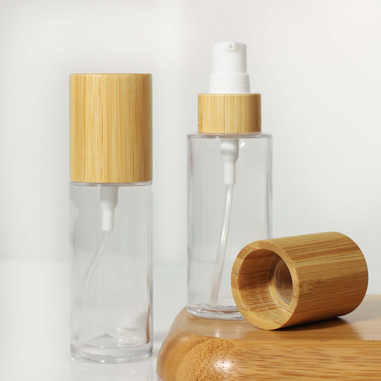 COSIDEA 6 pcs Empty 1.67oz / 50ml bamboo lids Clear glass bottle with lotion pump dispenser, refillable emulsion cosmetic cream Serum bottles, toiletries refill travel container