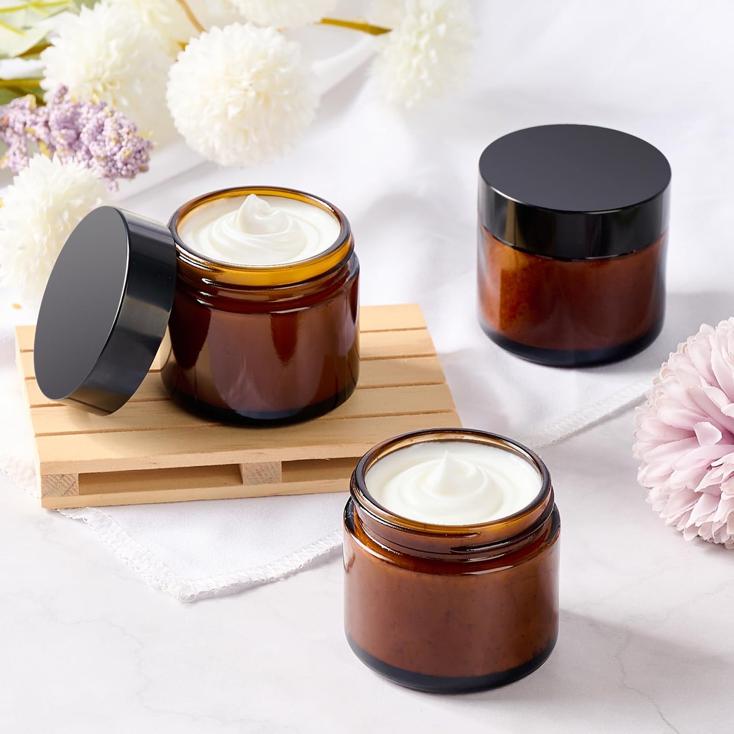 Qeirudu 2 Oz Small Glass Jars with Lids, 12 Pack Airtight Amber Cosmetic Jars with Inner Liners Round Empty Travel Sample Containers for Lotions, Creams, Candles, Body Butters