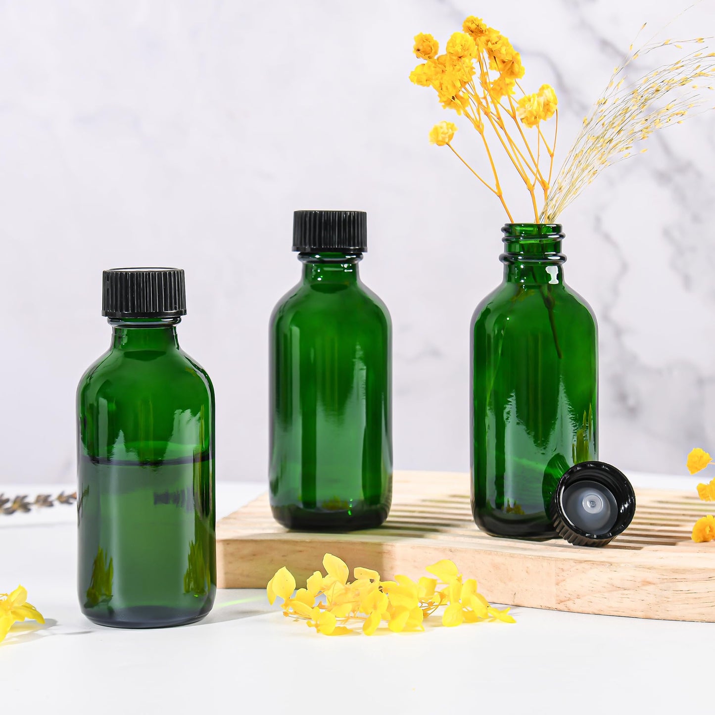 Exlvanto Small Glass Bottles with Lids Boston Round Shot Bottles for Health, Immunity, Ginger Juice, Essential Oils, Potion - Leak Proof Mini Travel Containers (Green UV, 2oz-24Pack)