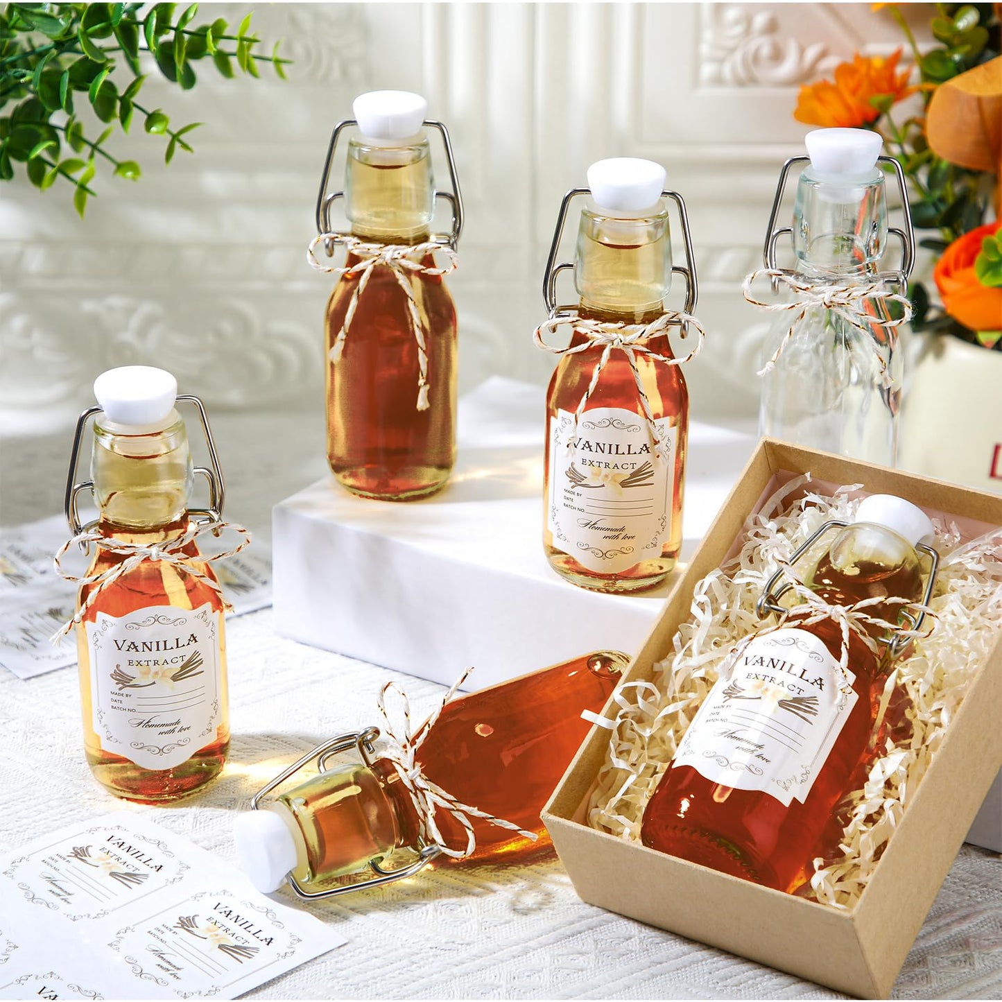 Queekay 20 Pack Mini Swing Top Glass Bottles for Vanilla Extract Homemade Olive Oil Bottles with Lids Airtight Cap Lids Labels for Wedding Baby Shower Favors(Clear,4oz)